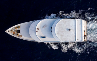 A view from above of a yacht at sea, where epoxy resin adds strength without increasing weight.